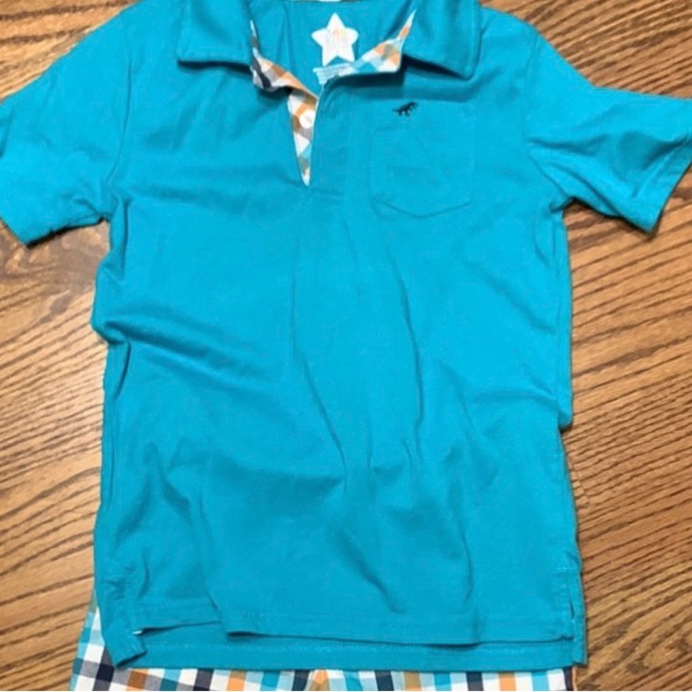 polo shirt sleeve shirt teal blue with cute plaid detail on button area. Size 7